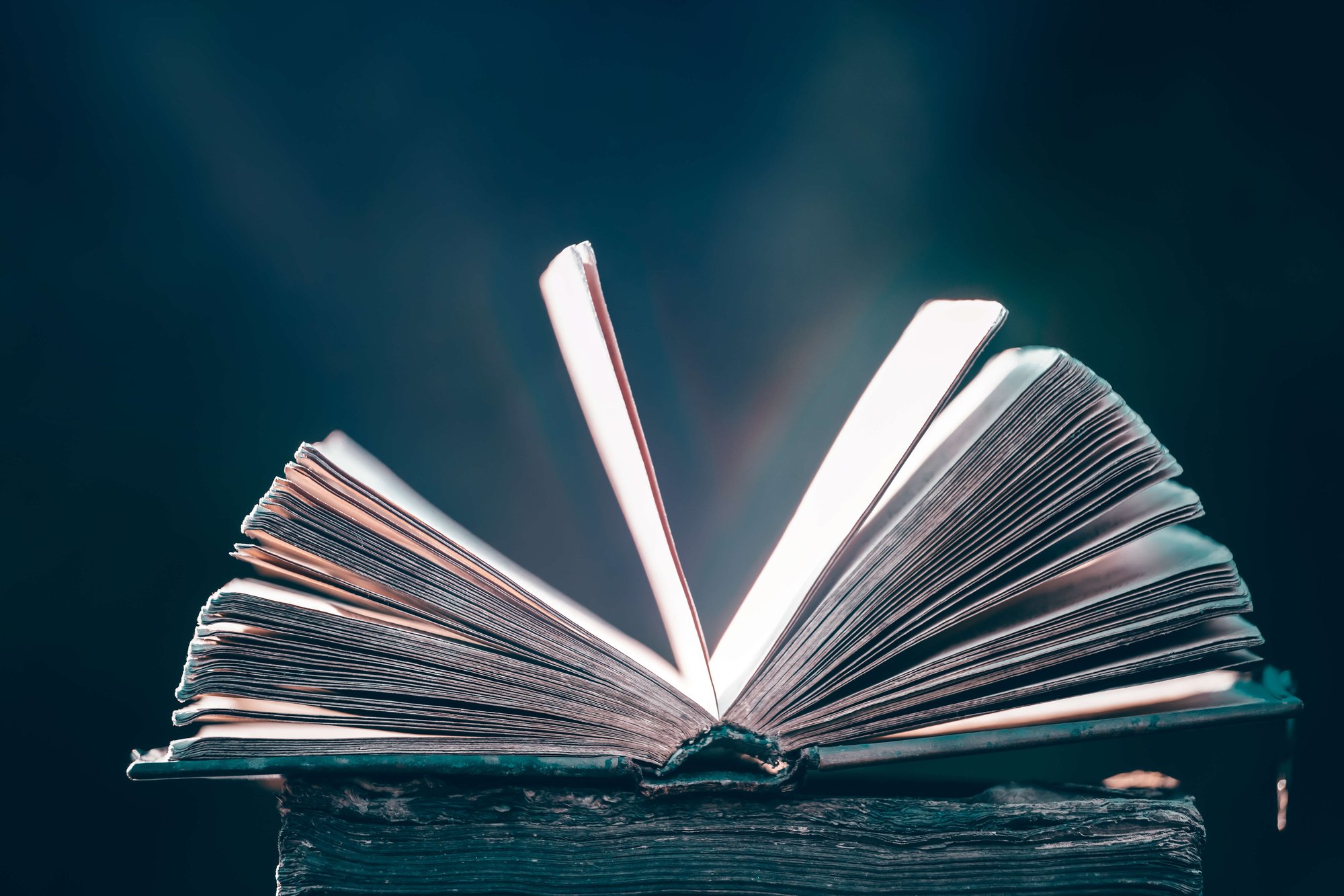 collection-of-old-books-on-dark-background-2025-03-24-08-40-22-utc (1)