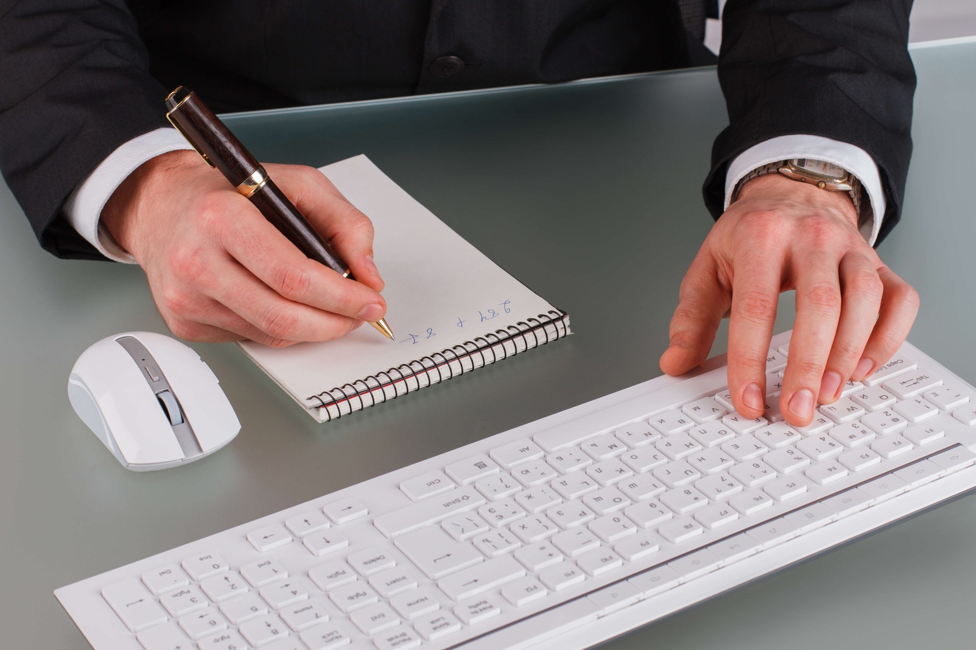 businessman-working-at-desktop-in-office-2024-09-17-20-33-16-utc (1)